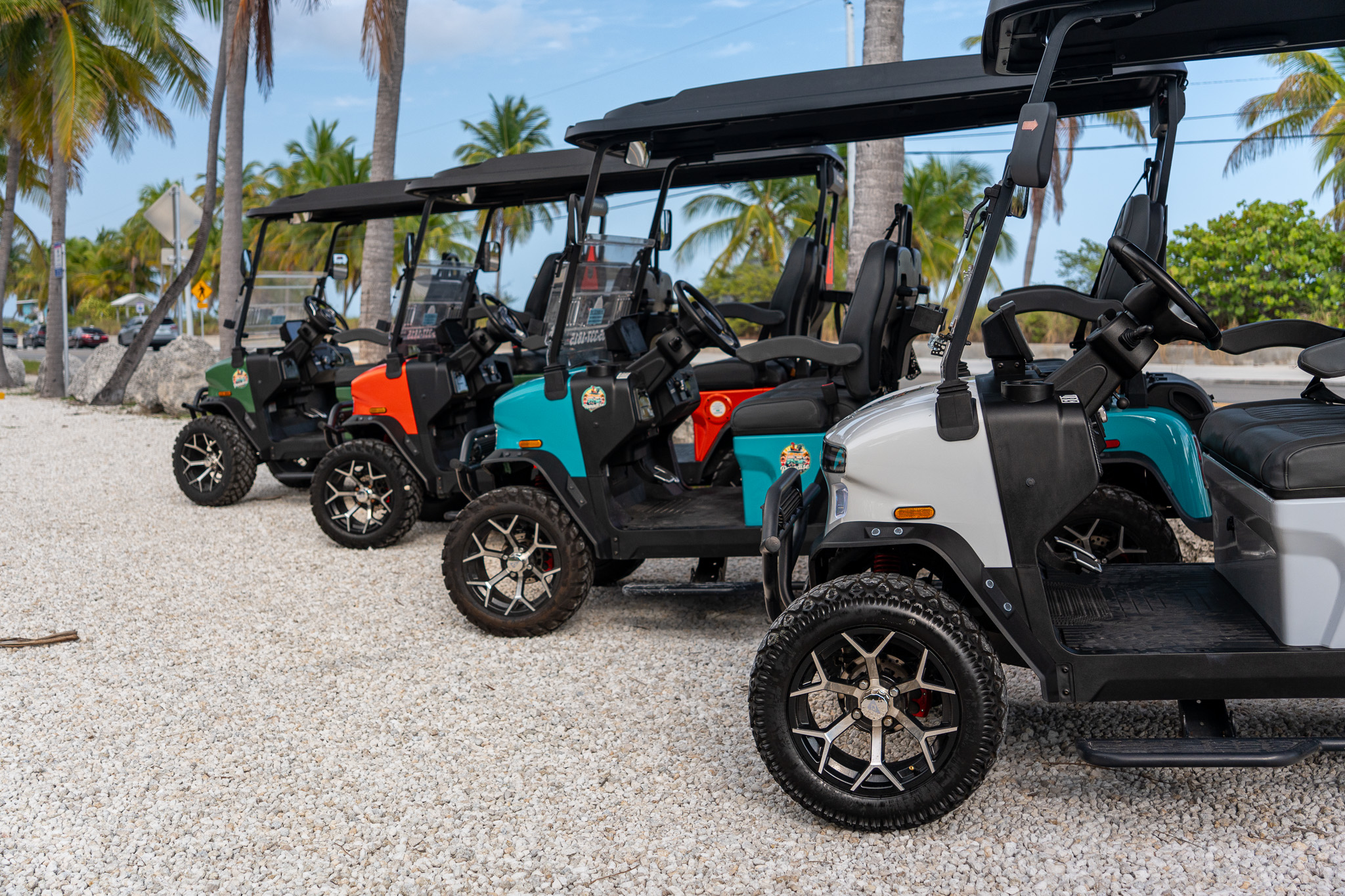 Four golf carts in a diagonal row