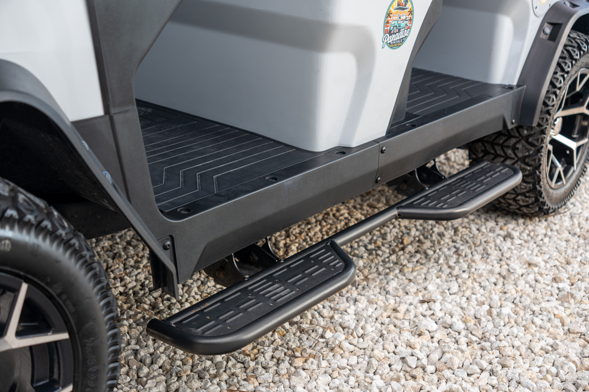 Golf cart side step and wheel detail